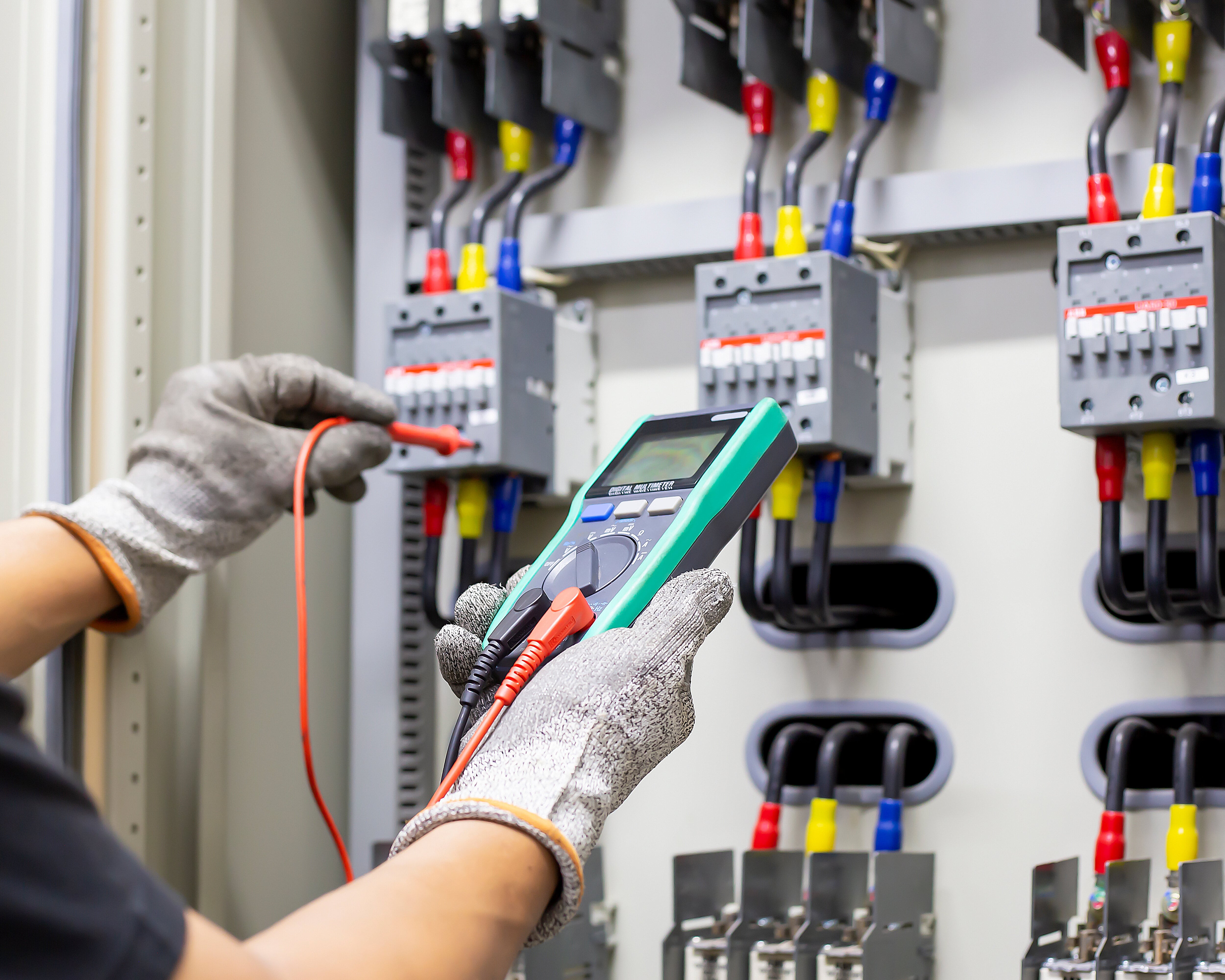 electrical engineer checks electrical control equipment.